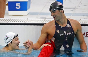 Gold medallist Michael Phelps, right, of the United States celebrates with South Korea\'s silver medallist Park Tae-hwan after the men\'s 200m freestyle swimming final on August 12 Jason Reed / Reuters